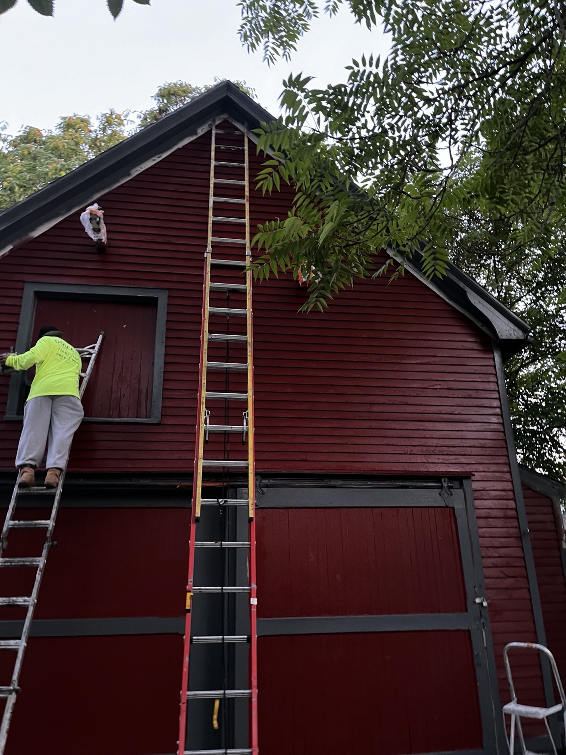 Restored red wood barn with dark trim